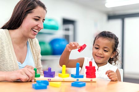 Therapist working with child