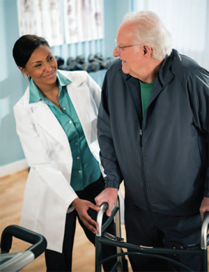 man with a walker receiving assistance from woman