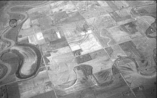 Figure 8: Air photo showing the Assiniboine River on the left edge of the photo and Mill Creek paleochannel. North is oriented towards the top of the photo (Photo courtesy of Dr. Bill Rannie).